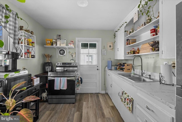 kitchen featuring sink, light stone counters, stainless steel electric range, dark hardwood / wood-style flooring, and white cabinets