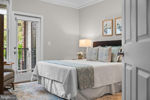 bedroom featuring access to exterior and ornamental molding