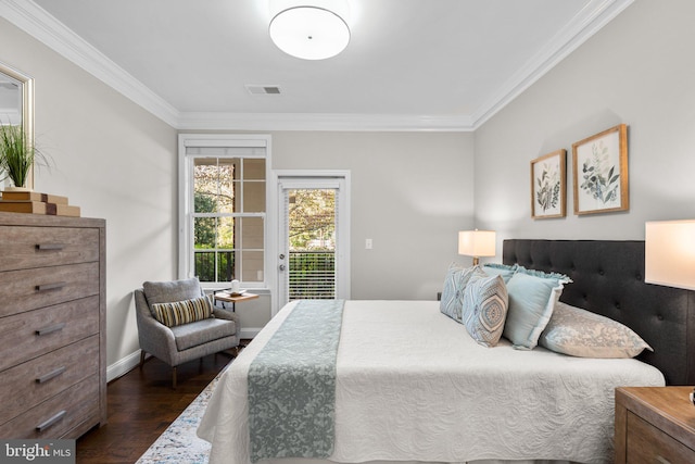 bedroom featuring crown molding, dark wood-type flooring, and access to outside