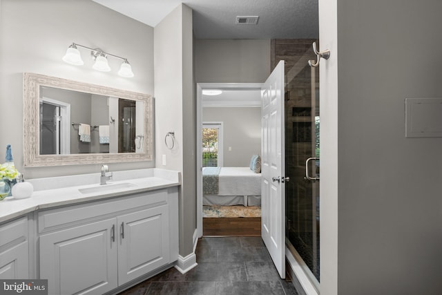 bathroom with vanity and a shower with shower door