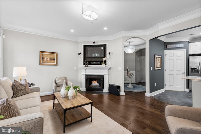 living room with dark wood-type flooring and crown molding