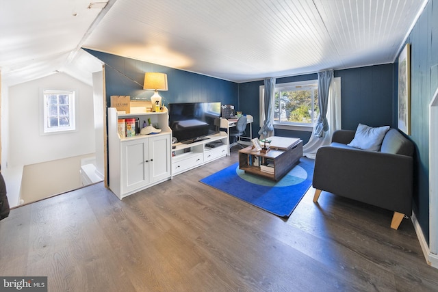 living room featuring vaulted ceiling and dark wood finished floors