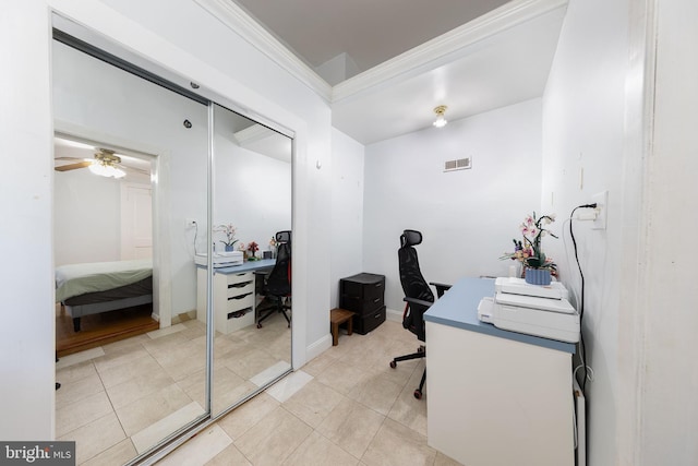 office featuring crown molding, ceiling fan, visible vents, and light tile patterned floors