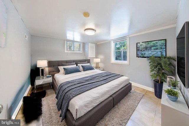 bedroom featuring baseboards and light tile patterned flooring