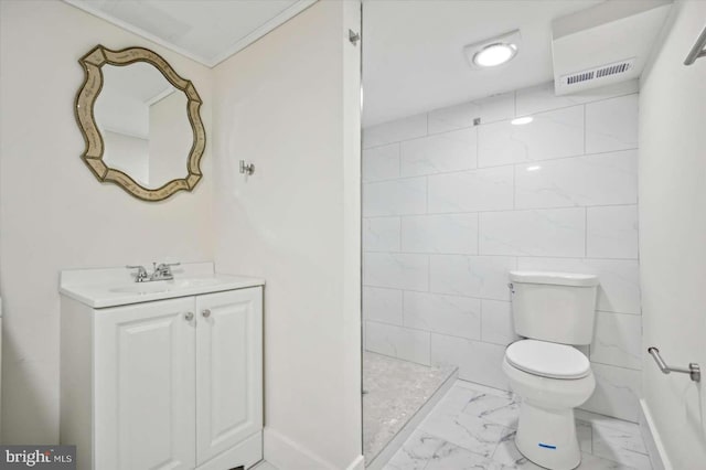 bathroom with vanity, a shower, tile walls, and toilet