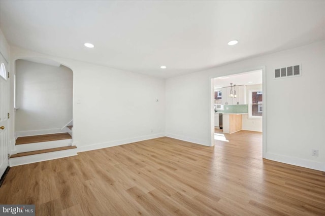 unfurnished room with light hardwood / wood-style floors