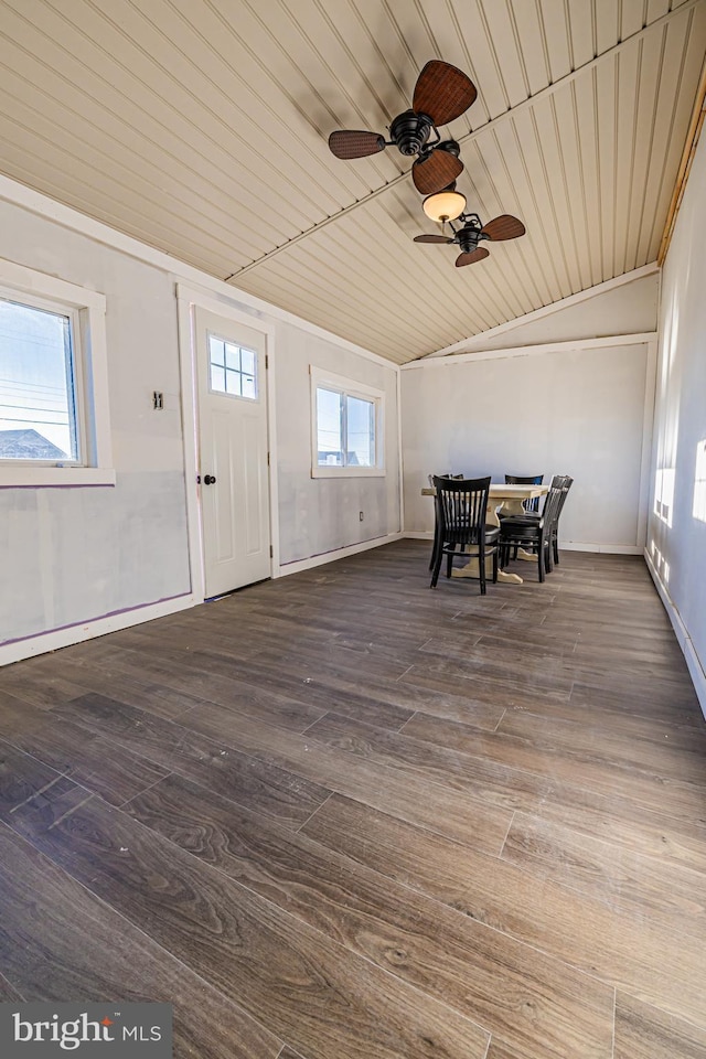 interior space with ceiling fan, lofted ceiling, dark hardwood / wood-style flooring, and wooden ceiling