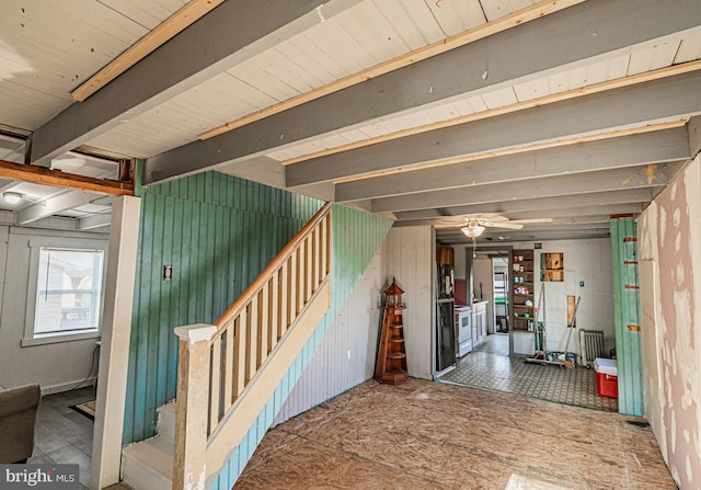 interior space with ceiling fan