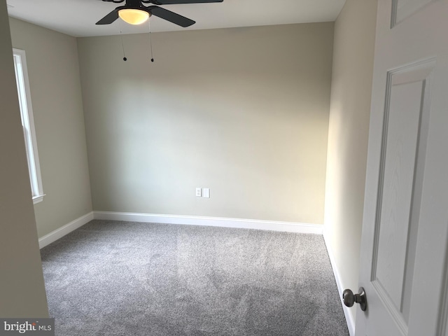 spare room with ceiling fan and carpet flooring