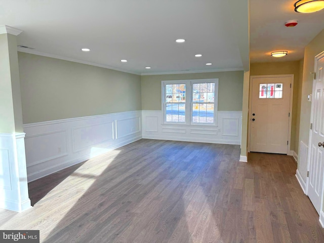 entryway featuring crown molding and dark hardwood / wood-style flooring