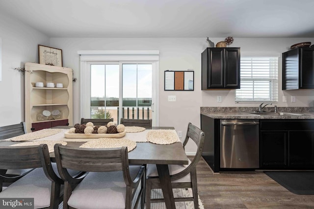 dining room with sink and dark hardwood / wood-style floors