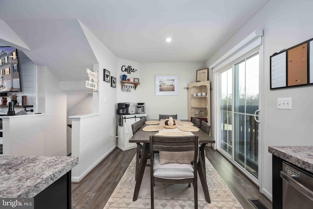 dining area featuring dark hardwood / wood-style flooring