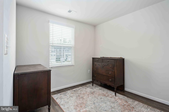 bedroom with hardwood / wood-style flooring