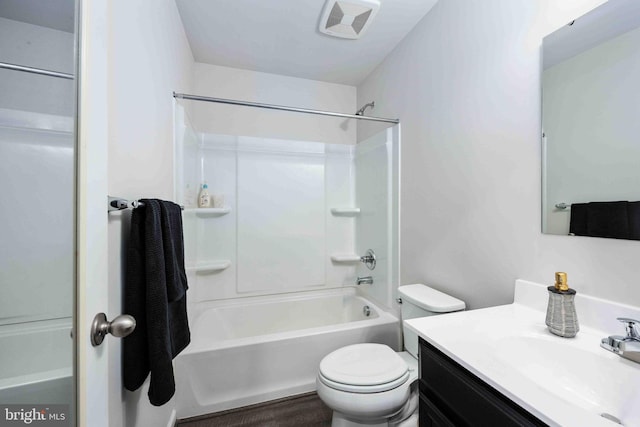 full bathroom featuring shower / tub combination, vanity, and toilet