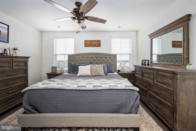 bedroom with hardwood / wood-style floors and ceiling fan