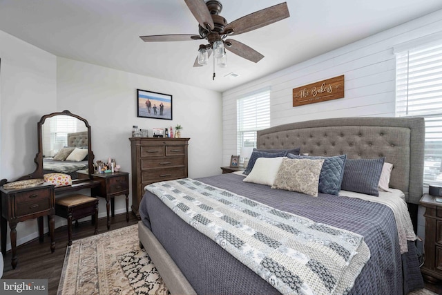 bedroom featuring dark hardwood / wood-style flooring and ceiling fan