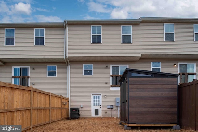 back of house featuring central air condition unit