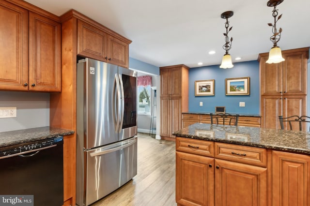 kitchen featuring stainless steel fridge, dishwasher, hanging light fixtures, and dark stone countertops