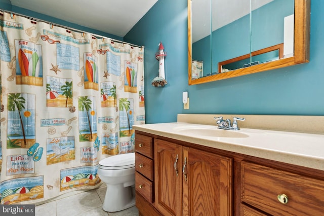 bathroom featuring tile patterned flooring, vanity, curtained shower, and toilet