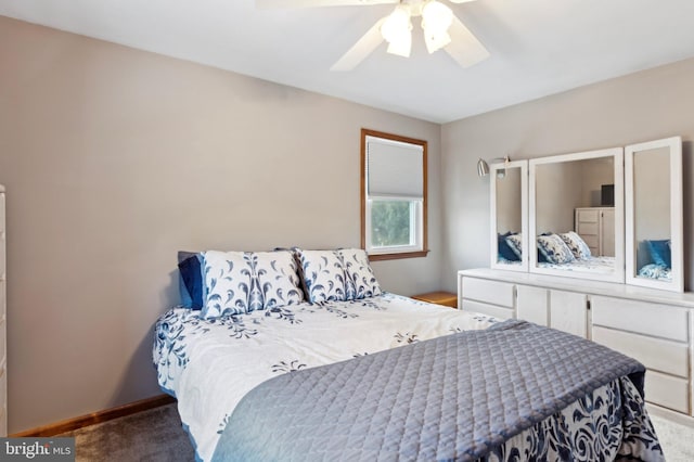 bedroom featuring ceiling fan and carpet