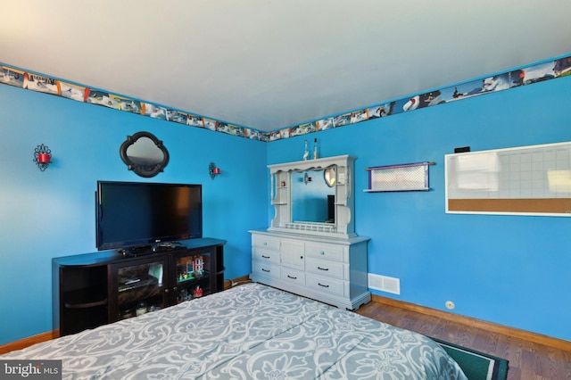 bedroom featuring wood-type flooring