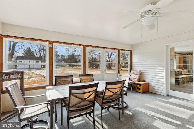 sunroom featuring ceiling fan