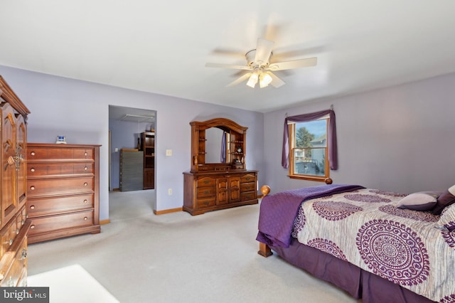 bedroom featuring light colored carpet and ceiling fan