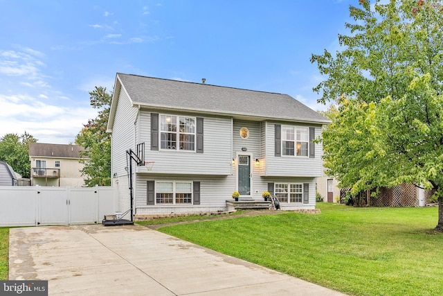 bi-level home with a front yard