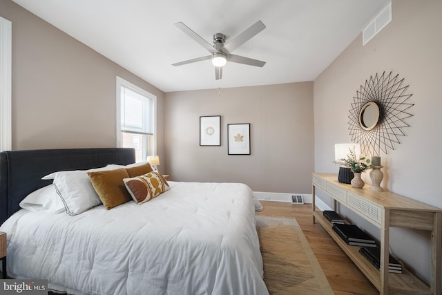 bedroom featuring light hardwood / wood-style flooring and ceiling fan