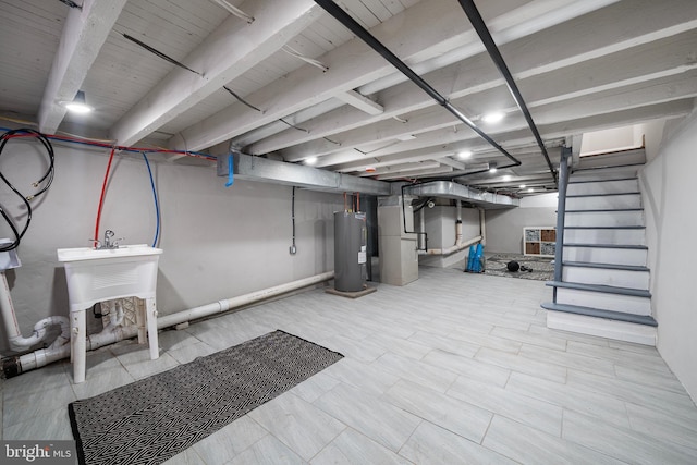 basement with electric water heater and heating unit