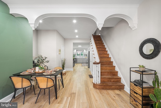 foyer entrance with light wood-type flooring