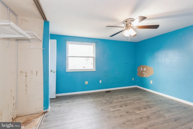 interior space with hardwood / wood-style floors and ceiling fan