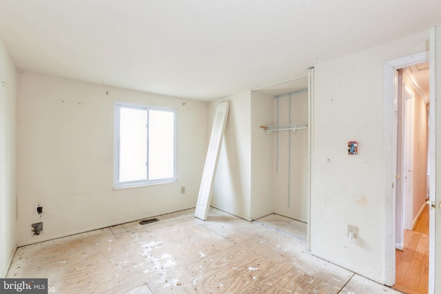 unfurnished bedroom featuring a closet