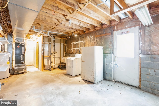 basement featuring washing machine and clothes dryer