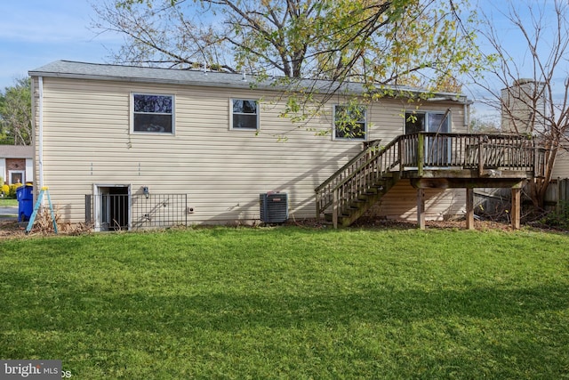 rear view of house featuring a yard, central air condition unit, and a deck