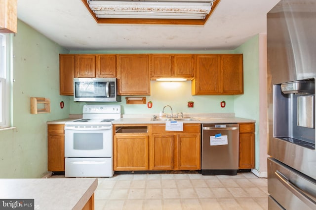 kitchen featuring stainless steel appliances and sink