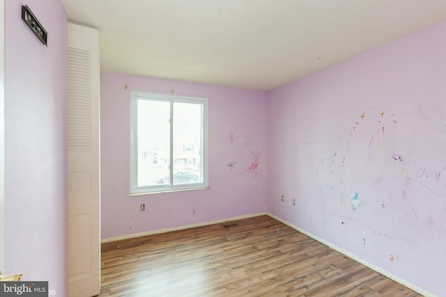 empty room with light wood-type flooring