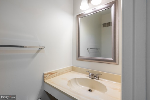 bathroom with a sink and visible vents