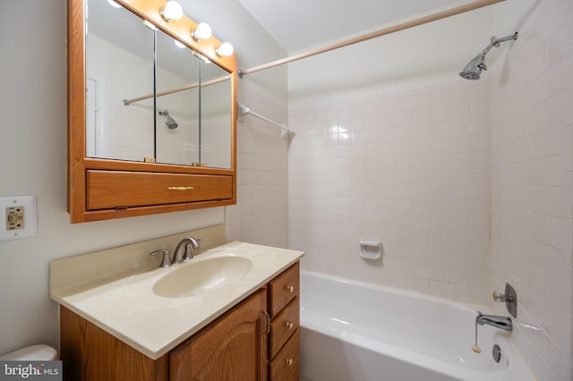 full bathroom featuring washtub / shower combination and vanity