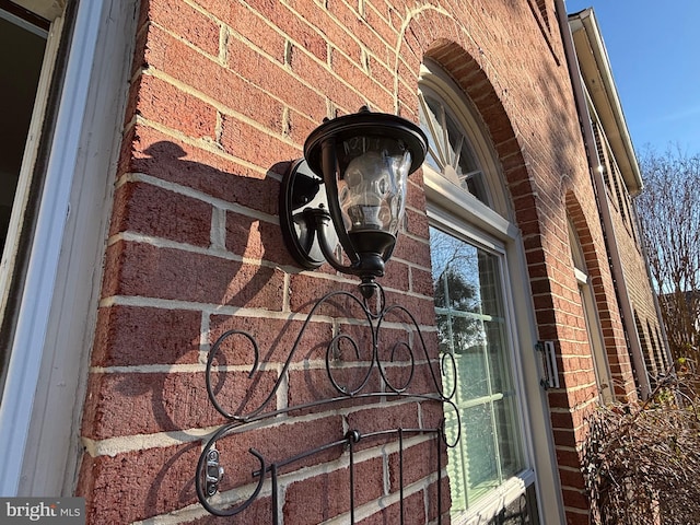 exterior details featuring brick siding