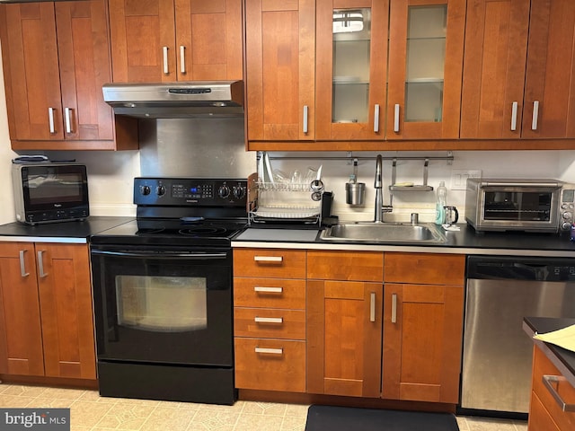 kitchen featuring dishwasher, glass insert cabinets, under cabinet range hood, black range with electric cooktop, and a sink