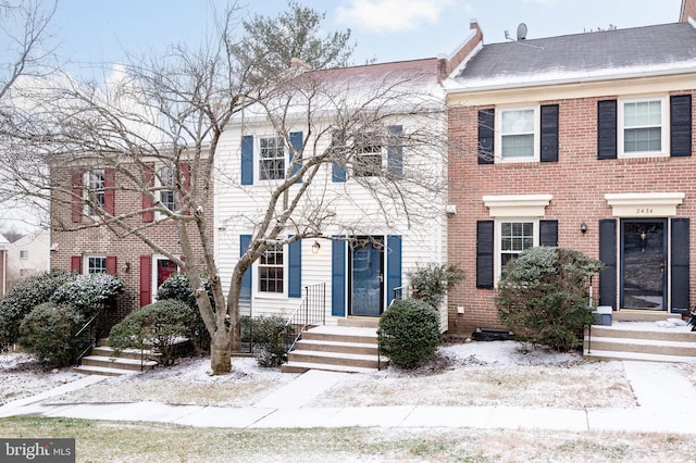 view of front of home with brick siding