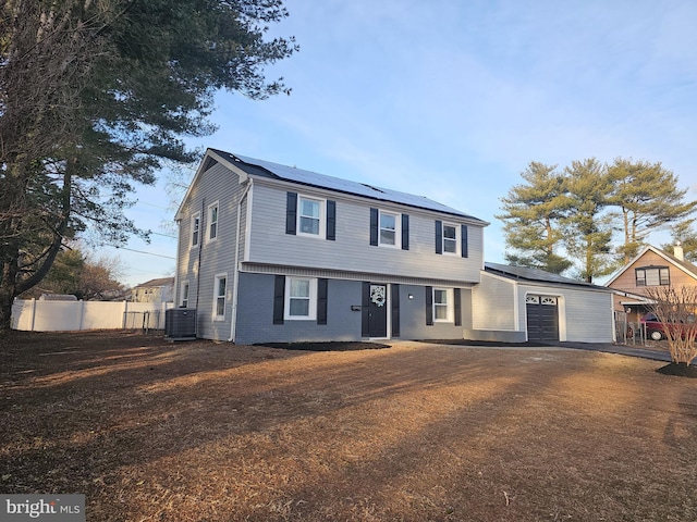 front of property with cooling unit and solar panels