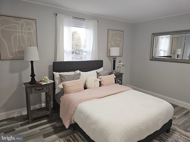 bedroom featuring dark hardwood / wood-style floors