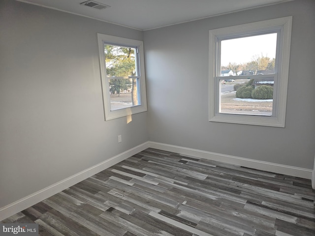 unfurnished room featuring dark wood-type flooring