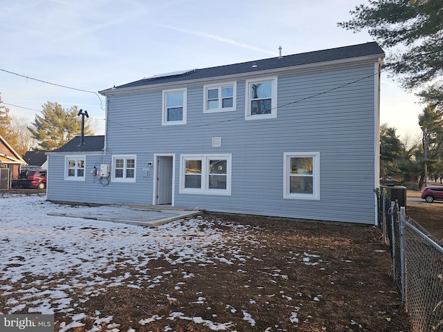 view of snow covered house