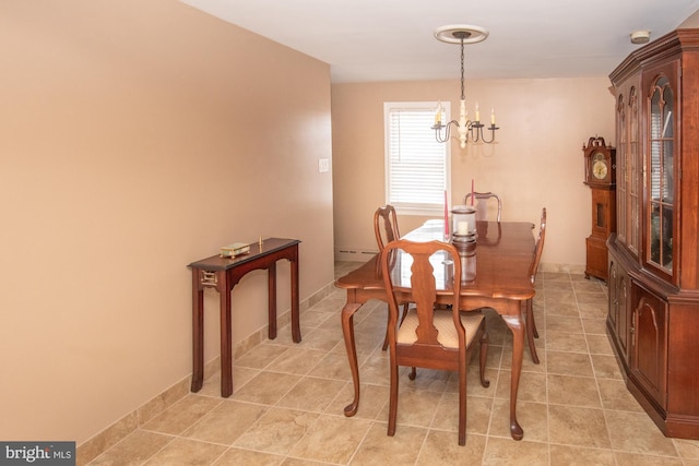 dining room featuring a baseboard radiator, light tile patterned floors, and a notable chandelier