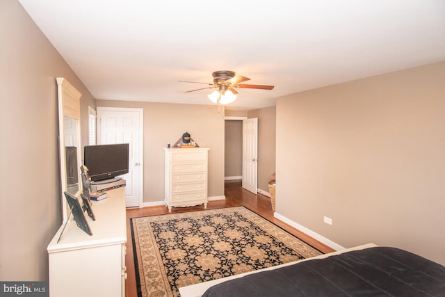 bedroom with hardwood / wood-style flooring and ceiling fan