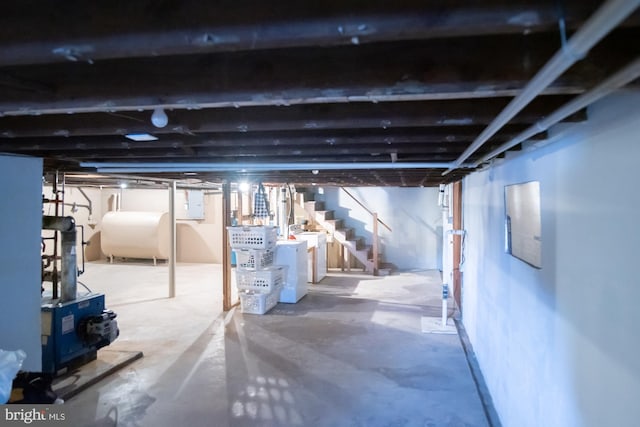 basement featuring washing machine and clothes dryer