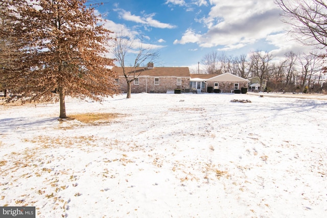 view of yard covered in snow